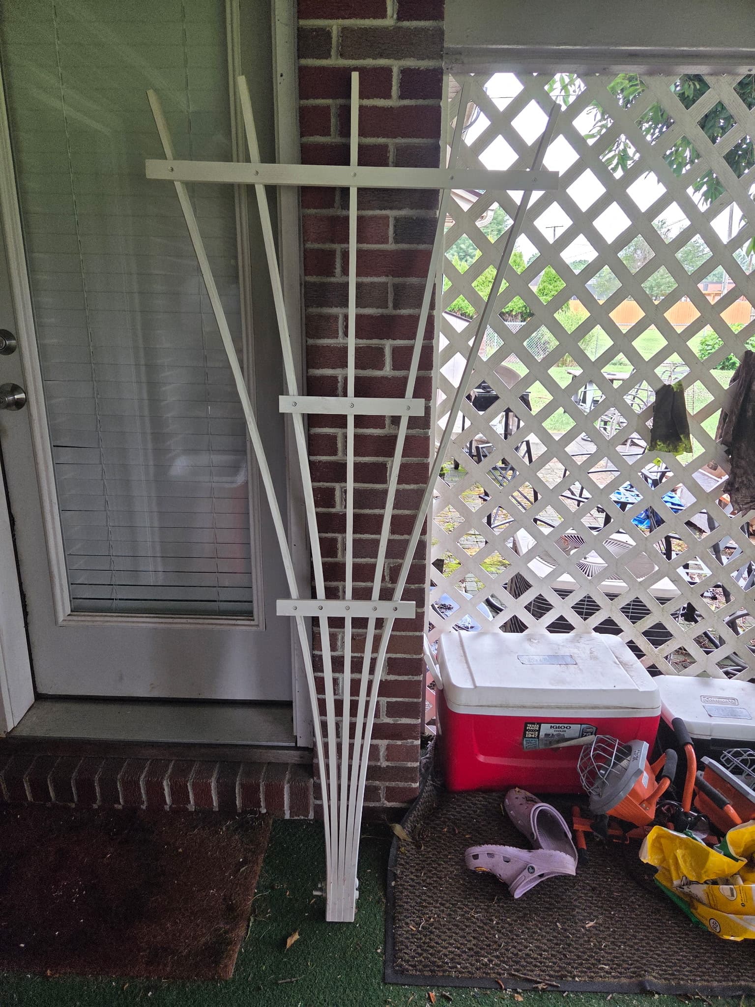 White fan-style wooden garden trellis